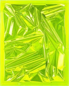 an abstract green and yellow background with lots of small pieces of plastic wrap around it