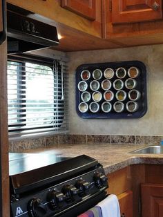 Spice Rack, metal tray with magnetic tins from Bed, Bath & Beyond Rangement Caravaning, Camper Storage Ideas Travel Trailers, Rv Storage Solutions, Kangoo Camper, Trailer Organization, Trailer Storage, Camper Organization, Camper Hacks, Trailer Decor