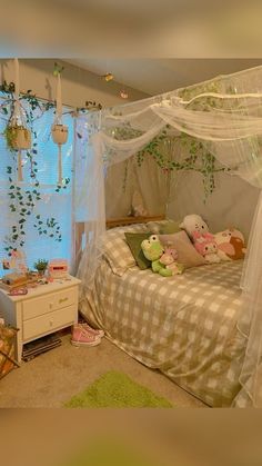 a bedroom with a canopy bed and green rugs