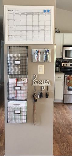 a refrigerator with several drawers and magnets on it