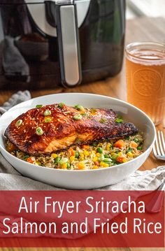 air fryer sriraca salmon and fried rice in front of an air fryer