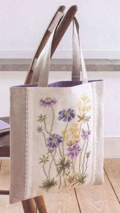 an embroidered bag with flowers on it