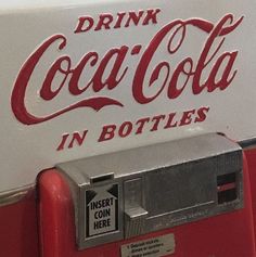 an old fashioned coca - cola machine with the words drink coca in bottles on it