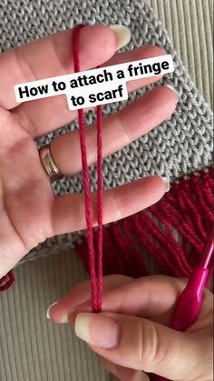 someone is knitting with red yarn and the words how to attach a fringe to scarf