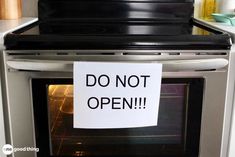 a sign on an oven door that says do not open