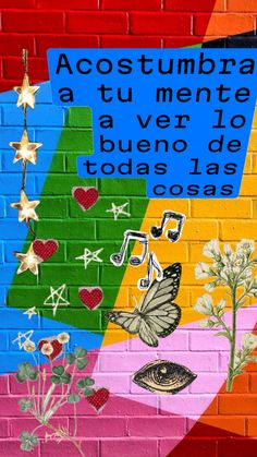 a brick wall painted with colorful images and words on it, along with the words acosttumbraa attu mente a ver do buenodo