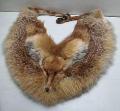 From a local estate, this original Brown Fox Tails fur wrap or scarf is in great condition. No flaws that I can see. It will be great for any collection or outfit. PLEASE NOTE THAT THE FOX IS VINTAGE MADE AROUND 1970's. ALL IS OLD STOCK. It is great for Viking, Celtic or Warrior outfits. Size: You can see the measurements in the photos. If you require any more information or pictures please contact me. Vintage Fox Stole, Warrior Outfits, Fox Tails, Fox Collar, Fox Scarf, Fox Fur Scarf, Warrior Outfit, Vulture Culture, Vintage Fox