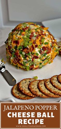 jalapeno popper cheese ball recipe on a plate with crackers next to it