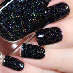 Party Bus is a gorgeous deep black jelly holographic shimmer. Precisely formulated to optimize depth, sparkle, and holographic payoff while maintaining an intense, jet black finish, Party Bus is bursting with holographic micro-flakes and shimmering iridescent flakes. Watch as glimmering hues of red, green, and blue dance across your nails to their own private party! Easily built up or sandwiched, the sheer formula of our jellies make way for our scattered holographic micro-flakes to work their m Sparkly Black Nails, Black Sparkle Nails, Black Nails With Glitter, Shimmer Nail Polish, Nail Shimmer, Black Nail Polish, Holographic Nail Polish, Black Rainbow, Sparkle Nails