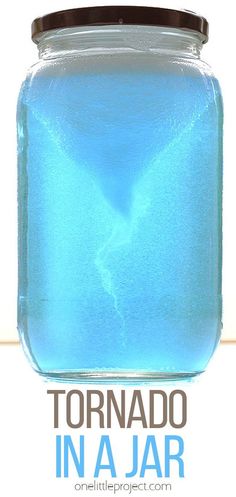 a jar filled with blue liquid sitting on top of a table