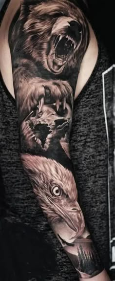 a man's arm with an eagle, bear and wolf tattoo on the sleeve