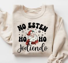 no esten ho ho, christmas holiday, christmas sweatshirt, christmas gift, jodiendo spanish, spanish christmas, funny spanish shirt, latina christmas, latino christmas, spanish mom gift, latino family gift, spanich sweatshirt, christmas santa, no estes ho ho jodiendo mexico family christmas shirt spanish christmas t shirts  con mi burrito sabanero  family christmas shirts in spanish  feliz navidad family shirts  Sizing and Color Information: My shirts are made-to-order specially for you. For this Latino Christmas, Latina Christmas, Mexican Sayings, Funny Spanish, Selling Ideas, Spanish Christmas, Cute Shirt Designs, Christmas Town