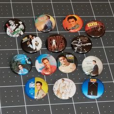 the elvis presley buttons are laid out on a table