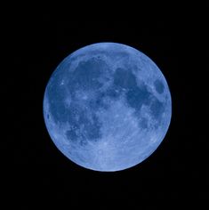 the full moon is seen in the dark sky