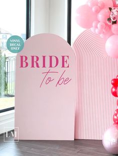 a bride to be sign next to balloons