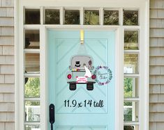 the front door is decorated with a wedding car and bride's date on it