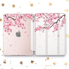 an ipad case with pink flowers on it and stars in the sky behind it, both side by side