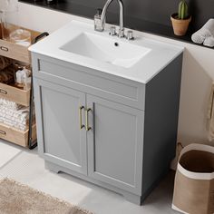 a bathroom sink sitting under a mirror next to a cabinet