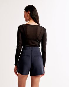 Elevate your wardrobe with the A&F Sloane Tailored Short, a blend of sophistication and comfort. Designed for the modern woman, these shorts offer a chic dark indigo hue that pairs effortlessly with any top.

- Size: 26
- Color: Dark Indigo
- Material: Polyester, Viscose, Elastane
- Gender: Female
- Features: Ultra high rise, figure-flattering pleating, functional fly, pockets, partially elasticated waistband

Crafted from a premium blend of polyester, viscose, and elastane, these shorts ensure Fitted Short Tops For Fall, Fitted Shorts With Short Inseam For Fall, Fitted Classic Shorts For Workwear, Classic Fitted Shorts For Workwear, Elegant Short Length Tops For Work, Fitted Short Length Tops For Work, Fitted Short Tops For Work, Chic Short Length Tops For Workwear, Chic Short Length Tops For Work