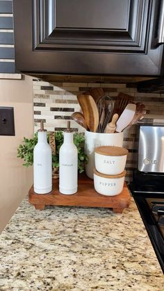 the kitchen counter is clean and ready to be used as a spice rack for cooking utensils