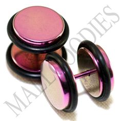 two pink and black metal knobs on top of each other's sides,