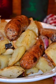 sausages and potatoes on a white plate