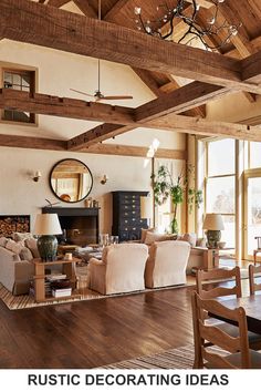 a living room filled with lots of furniture and a chandelier hanging from the ceiling