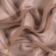 Mood's Premium Light Brown Silk Crinkled Chiffon is a sheer, lightweight and ethereal fabric with a subtle, crinkled texture. An excellent choice for fluid, top-weight garments, overlays, flowing scarves, and sheer insets such as ruffle details and draped extensions. 

Note: Dye lots are subject to change up to 10% in either direction. Ordering swatches is HIGHLY recommended for these products. Fabric Images, Silk Chiffon Fabric, Pure Chiffon, Club Color, Mood Fabrics, Dress Forms, Brown Silk, Fabric Width, Fashion Fabric