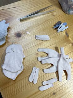 the doll's hands are made out of cloths and other crafting supplies