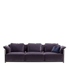 a gray couch with pillows on it against a white background