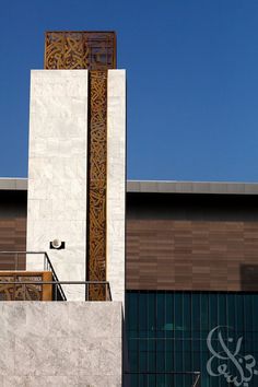 a tall clock tower sitting on the side of a building