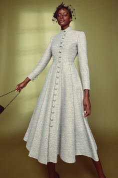 A soft and feminine coat dress with subtle military inspiration, the Madrid Coat Dress is cut from a beautiful metallic tweed with a soft silver base, intertwined with a pretty powder blue thread. Featuring a fitted tailored bodice with slim elegant sleeves and a high stand collar, as well as a beautiful knife pleated skirt, which creates gentle movement when walking. Highball self-covered buttons add a beautiful feature as well as a secure fastening, giving you the confidence to wear this coat Tweed Dress Winter, Suzannah London, Elegant Sleeves, Coat Dresses, Knife Pleated Skirt, Noble Lady, Knife Pleat, Boutique Couture, Winter Sky