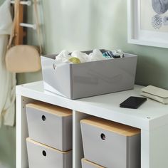 two bins on top of a white table in a room