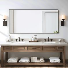 a bathroom vanity with two sinks and large mirror above it, along with folded towels on the floor