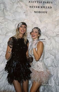 two women dressed in flappers and garb posing for a photo with the caption never killed nobody