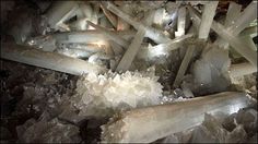 crystals and other rocks are shown in this image with the light shining on them from above