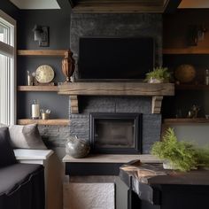 a living room filled with furniture and a flat screen tv mounted above a fire place