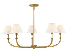 a brass chandelier with five lamps on each side and white shades hanging from the ceiling