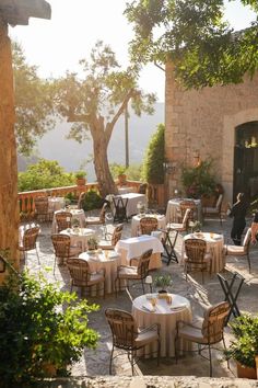 an outdoor dining area with tables and chairs