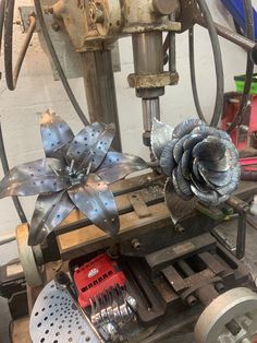 the machine is working on some metal flowers