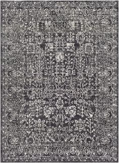 a black and white rug with an ornate design