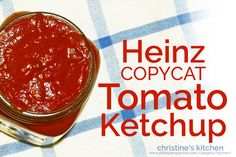 a jar of tomato ketchup sitting on top of a checkered table cloth