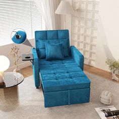 a living room with a blue chair and ottoman