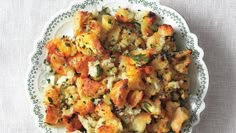 a white plate topped with stuffing on top of a table