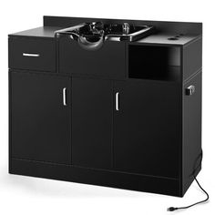 a black cabinet with a sink and power cord plugged into the sideboard, on an isolated white background