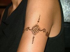 a woman with a tattoo on her arm