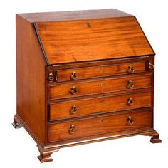 an old wooden desk with many drawers on it's sides and one drawer open