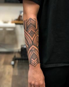 a man with a tattoo on his arm