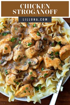 chicken stroganoni with mushrooms and sauce in a white bowl on top of a wooden table