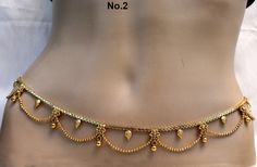 * Beautifully designed gold color belly chain. * can be used with belly dance costumes and saris. * D.no.1- Adjustable from32 to 40 inches Waist. * D.no.2- Adjustable from 32 to 40 inches Waist. * D.no.3- Adjustable from 32 to 40 inches Waist. * D.no.4- Adjustable from 24 to 36 inches Waist. Gold Waist Belt Indian Simple, Ottiyanam Designs Gold Simple, Indian Belly Chain, Waist Chain Indian Bridal, Traditional Waist Chain With Latkans For Festivals, Traditional Waist Chain With Latkans For Festive Occasions, Traditional Festive Waist Chain With Latkans, Elegant Gold Waist Chain For Festivals, Elegant Festive Waist Chain